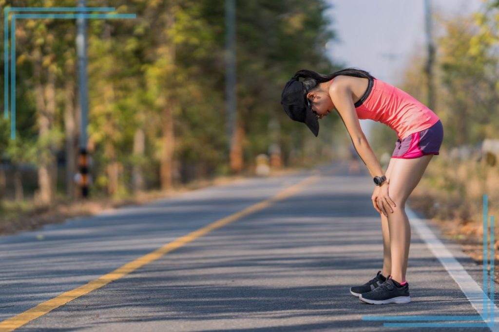A woman runner taking a break.