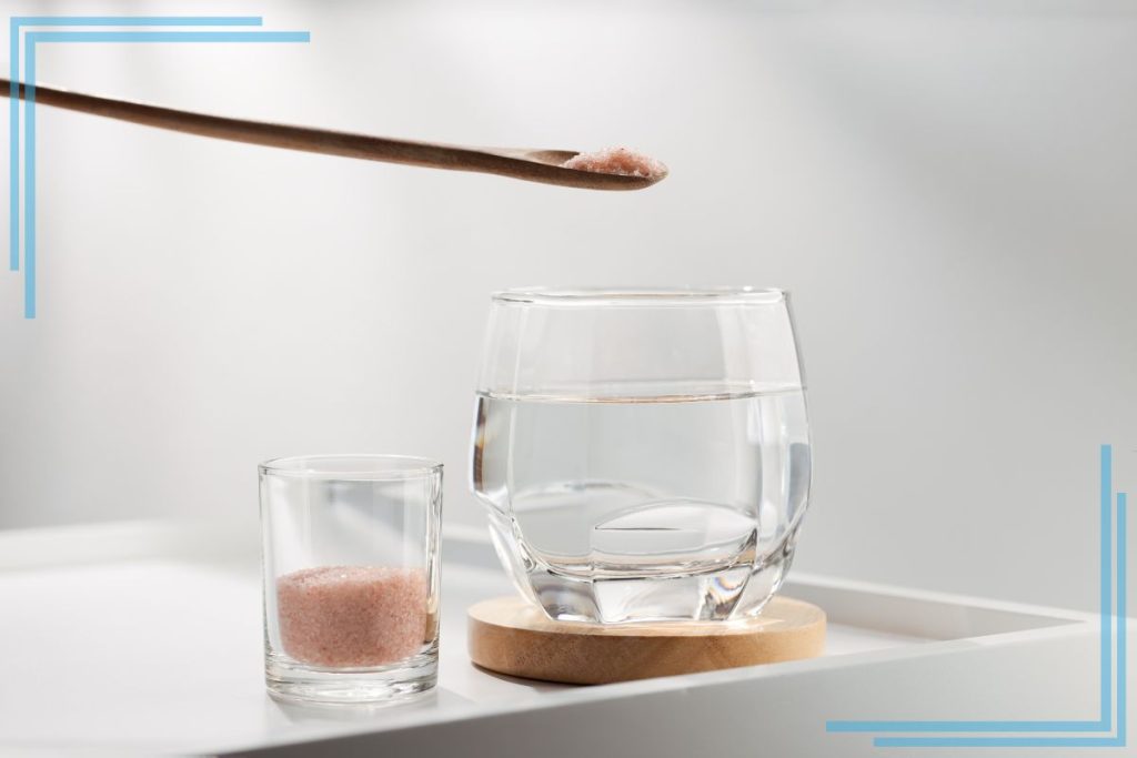 A glass of water with salt.