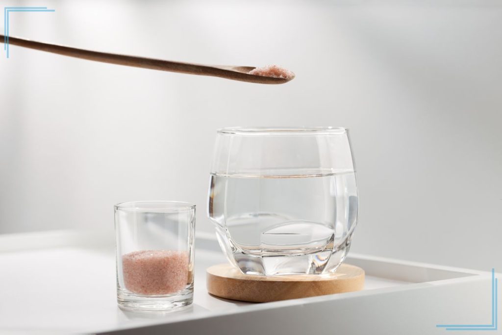A glass of water with salt.